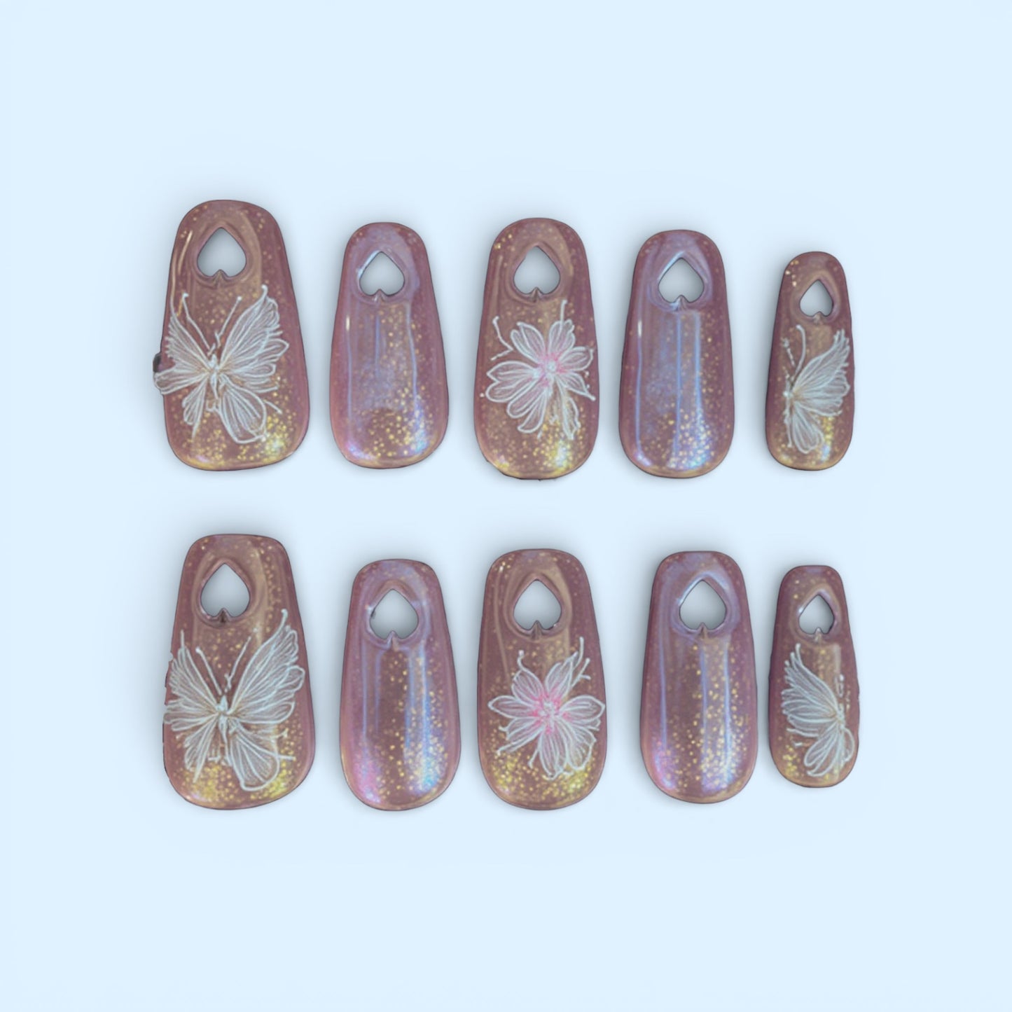 Pink Nails with Cut Out Hearts on the Tips (med coffin)