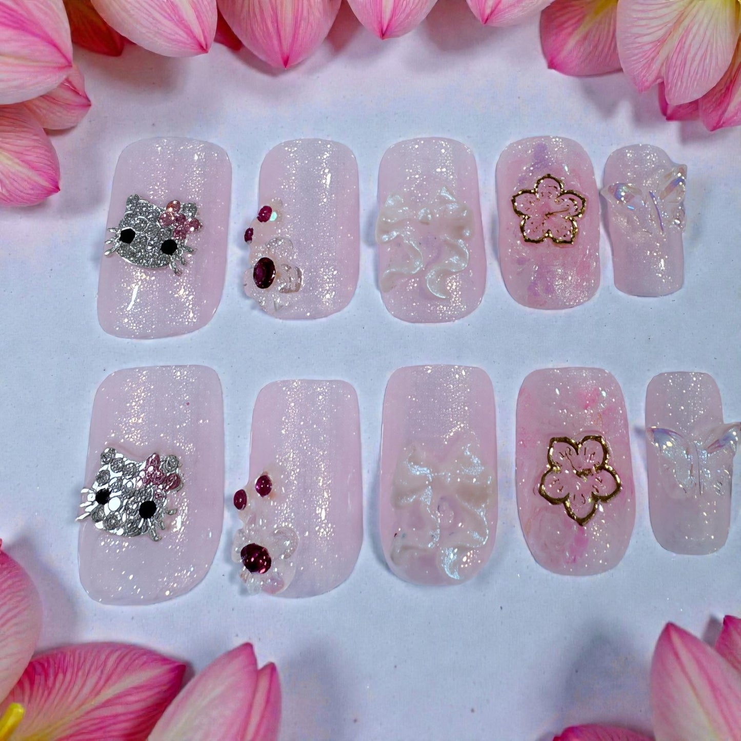 Pink short square hello Kitty nails